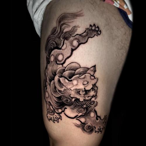 Traditional Fu Dog Thigh Tattoo in Blackwork Style